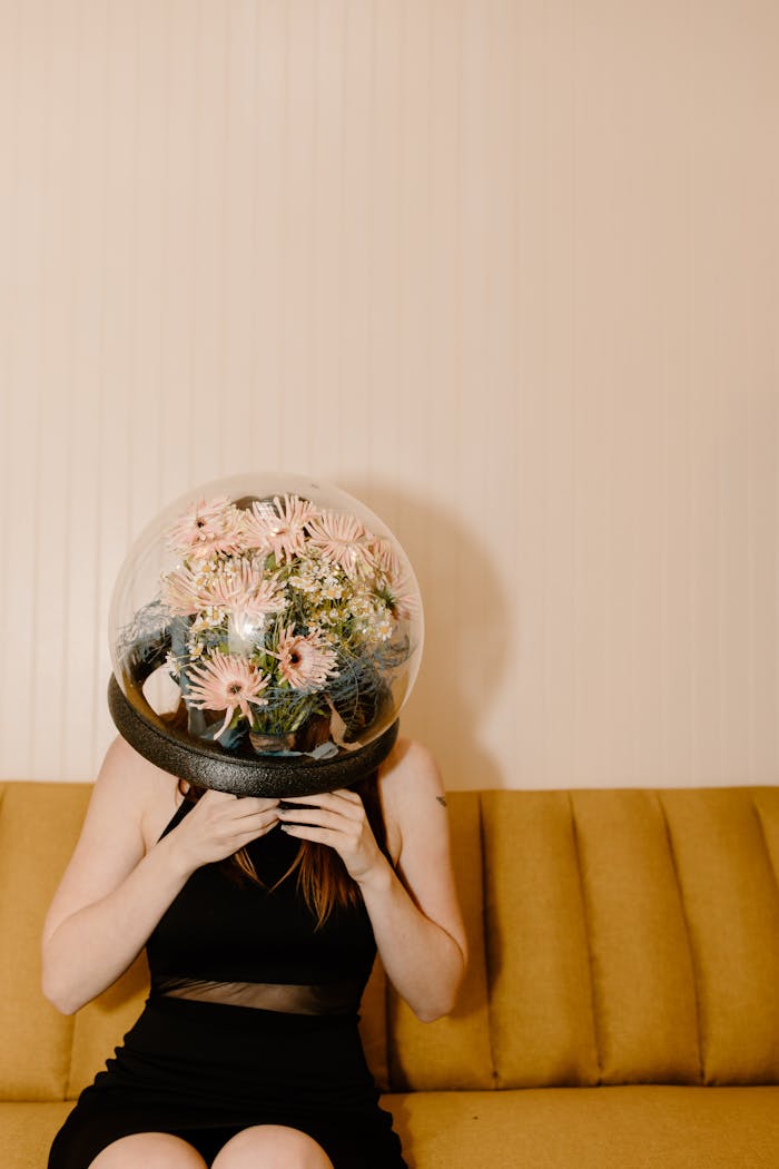 "Why AI ScreenplayS Suck (And How to Fix THEM)" A woman in a black dress wears a flower-filled dome, blending nature and futurism.