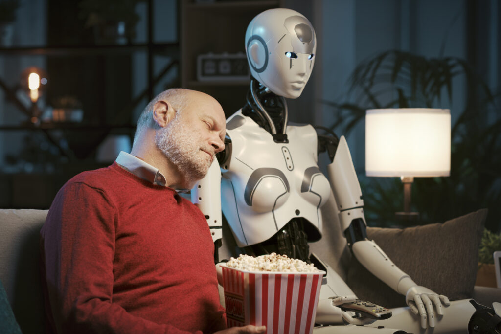 sleepy man watching movies with a robot